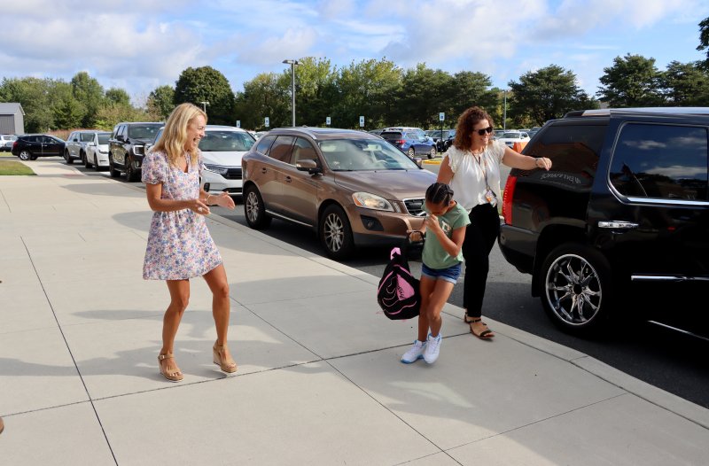 Cape Henlopen School District Superintendent Jenny Nauman, left, welcomes fourth-grader Tyliah Gibbs. Nauman is starting her first year as Cape superintendent. BILL SHULL PHOTO